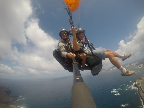 Flying over las canteras beach on a paraglider